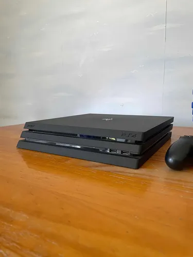 Sony PS4 Pro consola con mandos y juegos